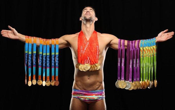 Man Holding Medals